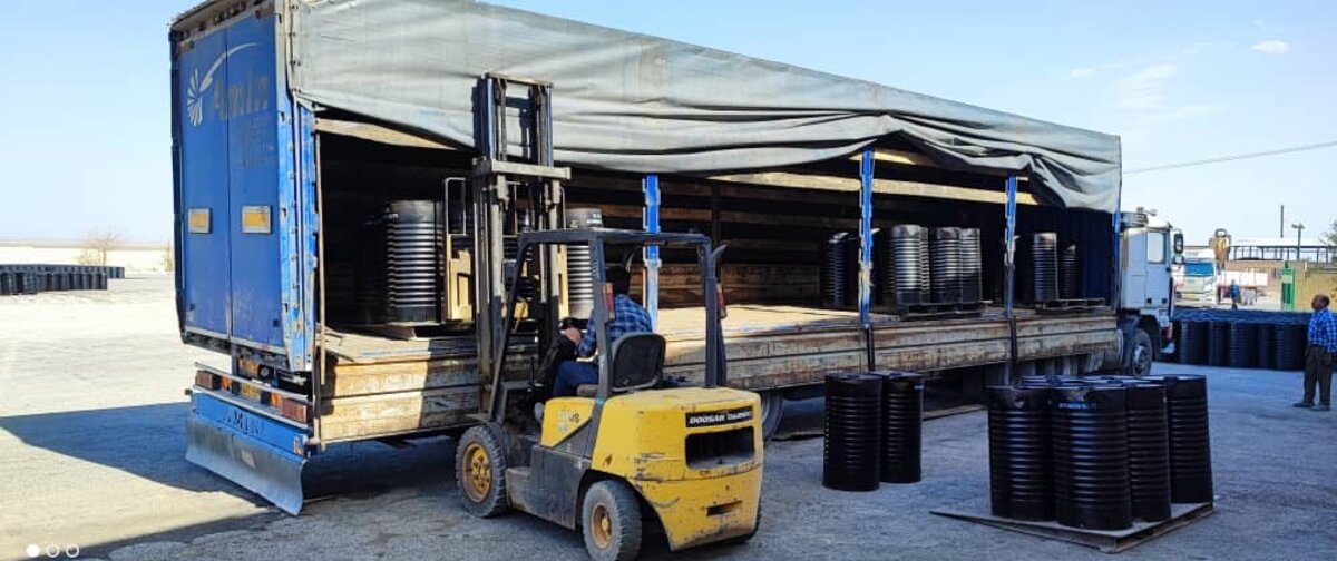 Drums loaded onto truck for delivery